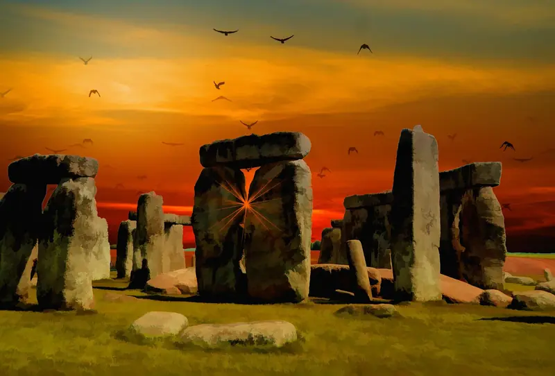 Stonehenge stone circle silhouetted against a fiery sunset sky, Wiltshire