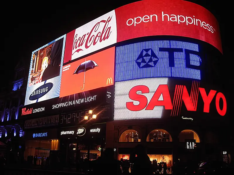 Piccadilly Circus illuminated advertising screens at night, London